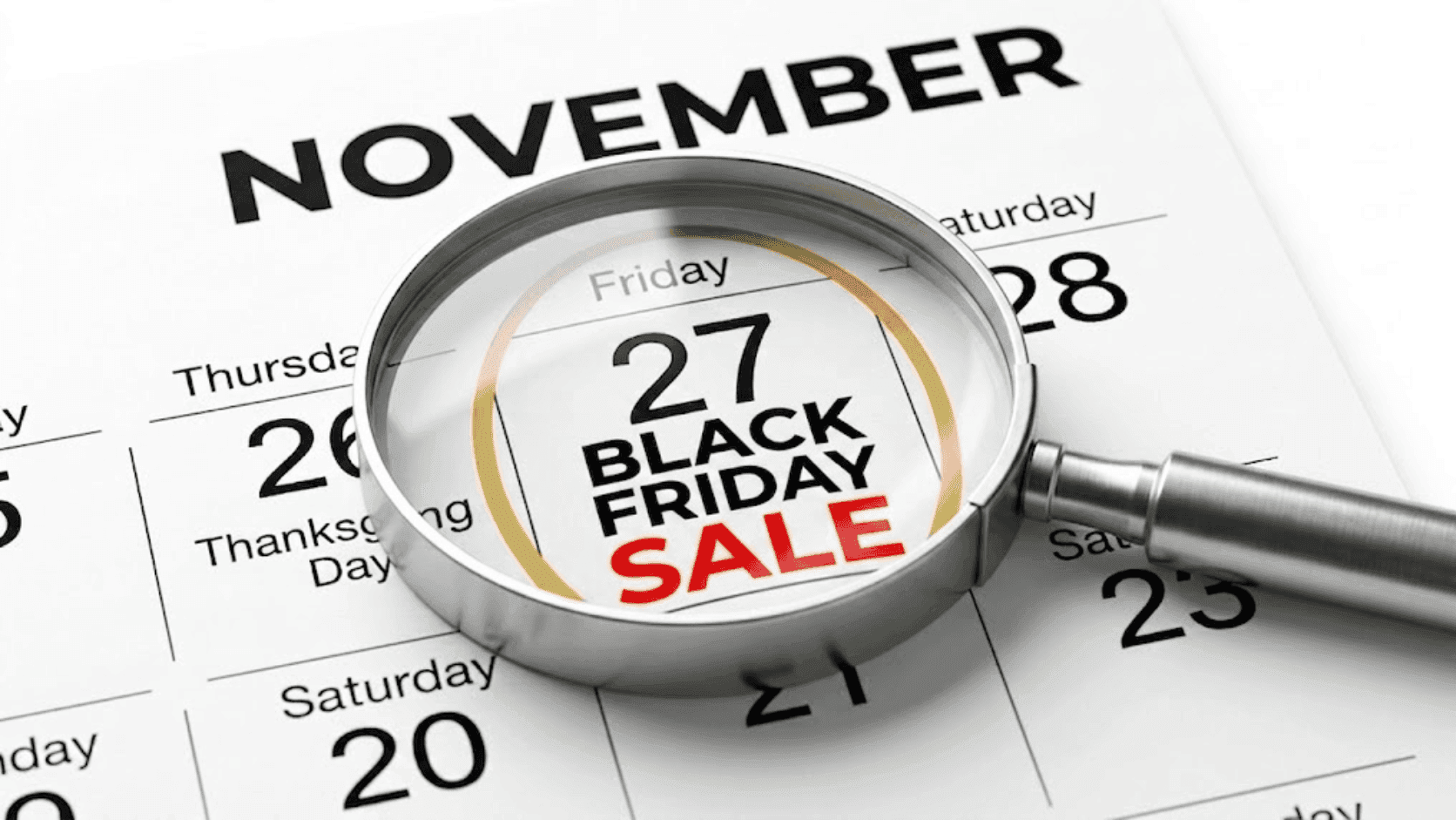Magnifying glass highlights 'BLACK FRIDAY SALE' on a November 27th calendar.